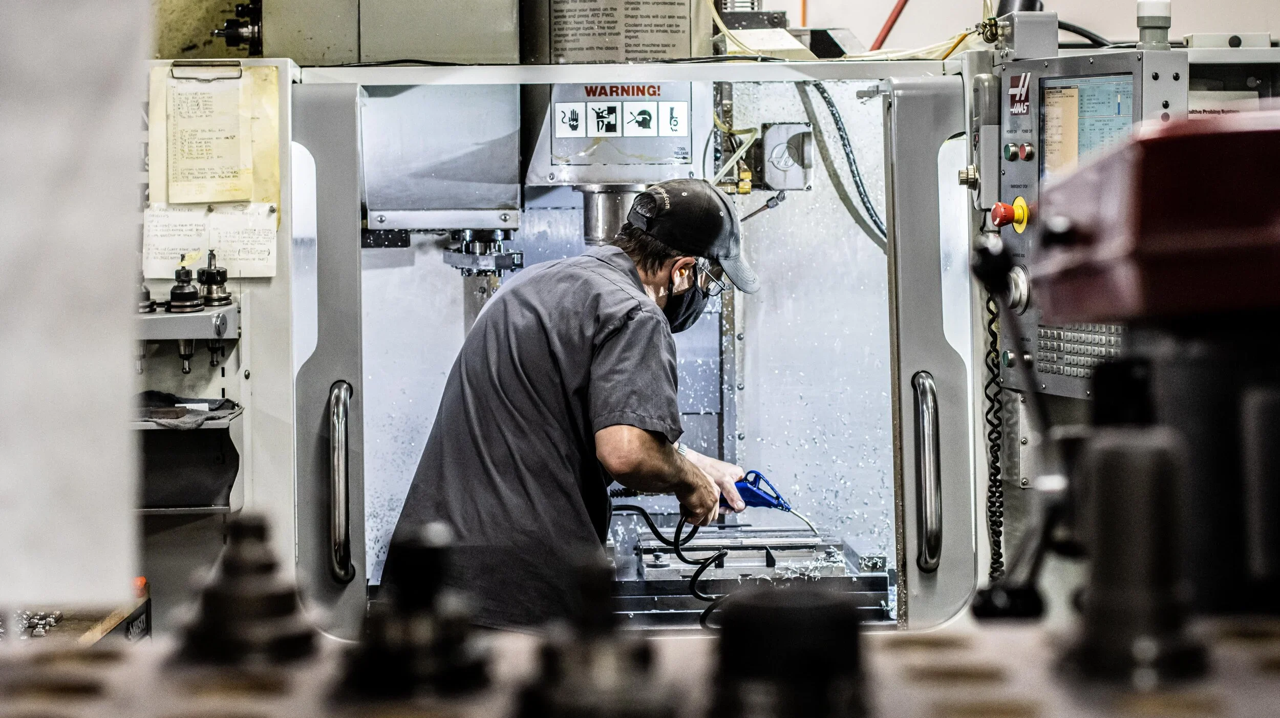 CNC operator performing precision engineering work